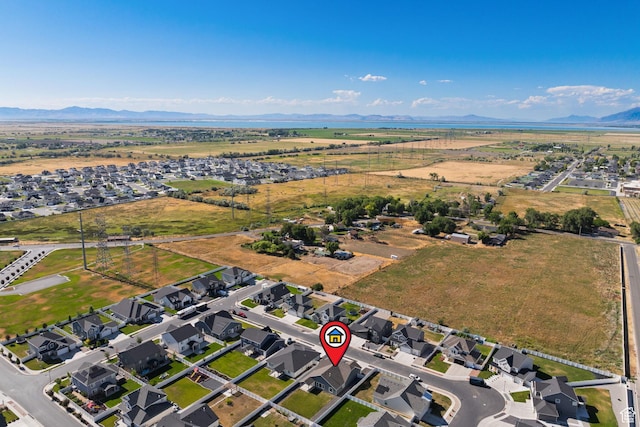 3105 W 3150 N, Plain City, UT 84404 - aerial overview of property's location featuring a mountain backdrop and nearby suburban area