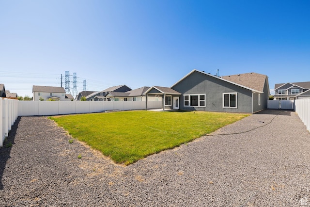 3105 W 3150 N, Plain City, UT 84404 - rear view of property with a fenced backyard, stucco siding, and a patio area