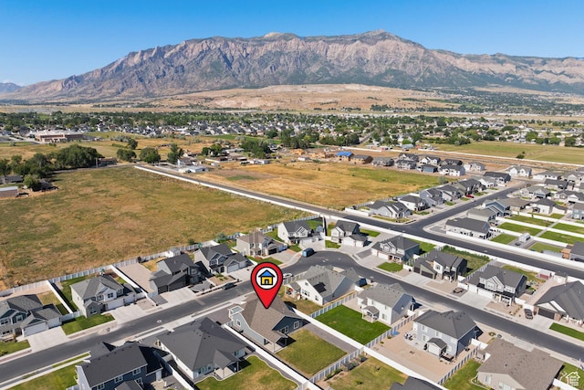 3105 W 3150 N, Plain City, UT 84404 - aerial overview of property's location with a mountainous background and nearby suburban area