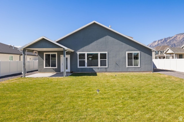 3105 W 3150 N, Plain City, UT 84404 - back of house featuring a patio area, a fenced backyard, stucco siding, and a mountain view