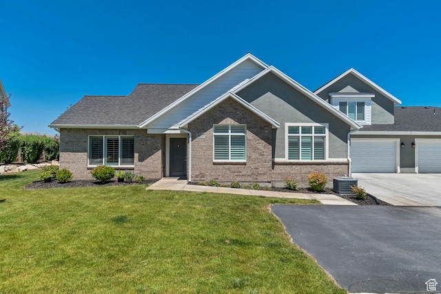 453 S Short Horse Ln Unit C, Saratoga Springs, UT 84045 - view of front of house featuring brick siding, driveway, a front yard, and a garage