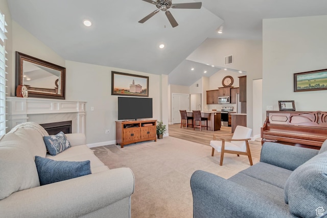 453 S Short Horse Ln Unit C, Saratoga Springs, UT 84045 - living area with ceiling fan, high vaulted ceiling, a high end fireplace, recessed lighting, and light colored carpet