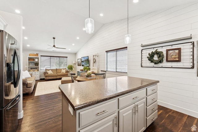 422 W 390 S, Spanish Fork, UT 84660 - kitchen featuring stainless steel fridge with ice dispenser, plenty of natural light, dark wood-style floors, high vaulted ceiling, and a kitchen island