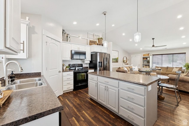 422 W 390 S, Spanish Fork, UT 84660 - kitchen featuring appliances with stainless steel finishes, a center island, dark wood-style flooring, open floor plan, and white cabinetry