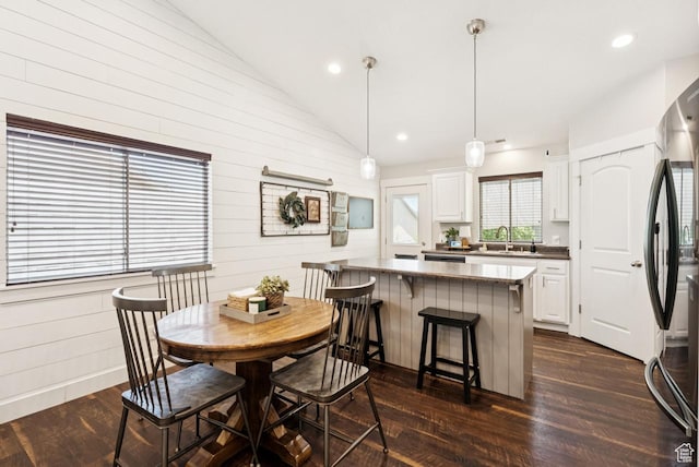 422 W 390 S, Spanish Fork, UT 84660 - dining area with lofted ceiling, dark wood-style floors, wood walls, and recessed lighting