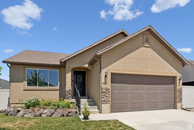 422 W 390 S, Spanish Fork, UT 84660 - view of front of property with an attached garage, concrete driveway, stucco siding, and stone siding