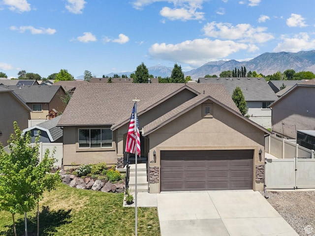 422 W 390 S, Spanish Fork, UT 84660 - view of front of property featuring stucco siding, a gate, an attached garage, concrete driveway, and a mountain view