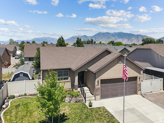 422 W 390 S, Spanish Fork, UT 84660 - ranch-style house featuring stucco siding, a mountain view, driveway, an attached garage, and a gate