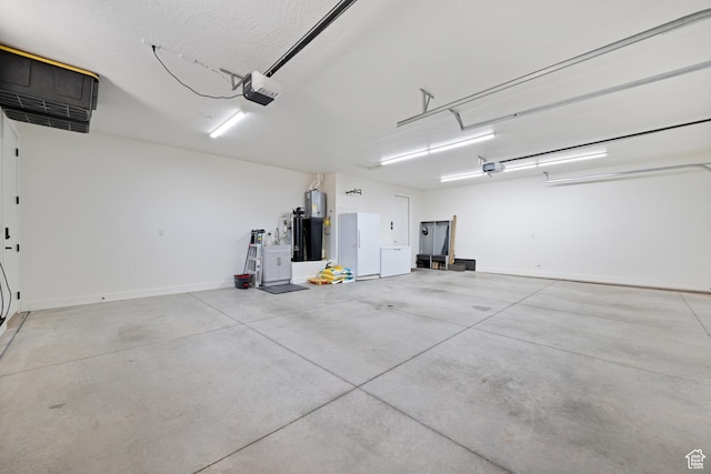 507 N 3650 W, Hurricane, UT 84737 - garage featuring freestanding refrigerator and a garage door opener