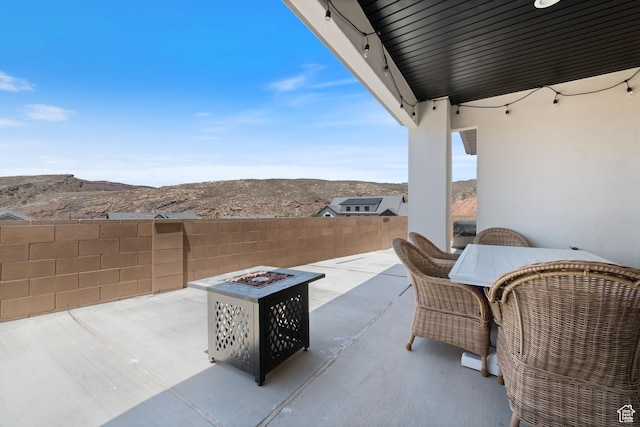 507 N 3650 W, Hurricane, UT 84737 - fenced backyard with a fire pit, a mountain view, a patio, and outdoor dining area