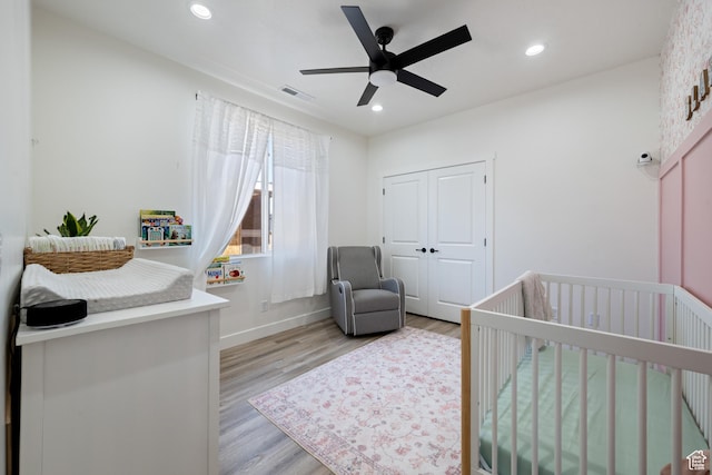 507 N 3650 W, Hurricane, UT 84737 - bedroom featuring a nursery area, light wood-style floors, recessed lighting, a ceiling fan, and a closet