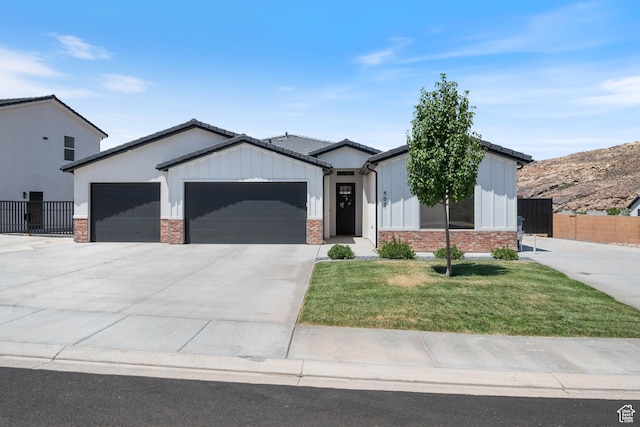 507 N 3650 W, Hurricane, UT 84737 - modern inspired farmhouse with an attached garage, driveway, board and batten siding, and brick siding
