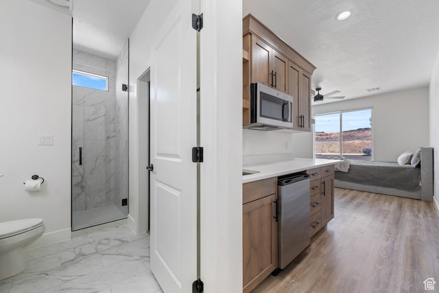 507 N 3650 W, Hurricane, UT 84737 - kitchen with stainless steel appliances, healthy amount of natural light, light marble finish floors, and light countertops