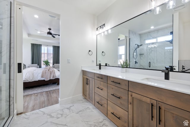 507 N 3650 W, Hurricane, UT 84737 - bathroom featuring double vanity, ensuite bathroom, a marble finish shower, marble look tile flooring, and a ceiling fan