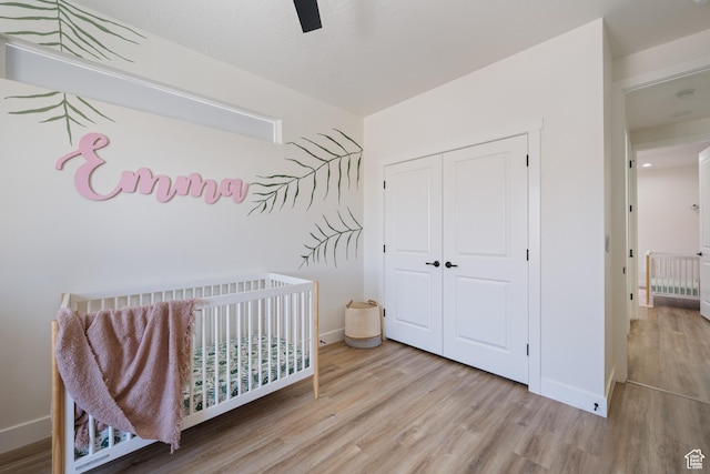 507 N 3650 W, Hurricane, UT 84737 - bedroom with wood finished floors, a crib, a closet, and ceiling fan