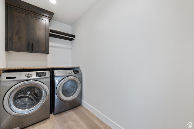 507 N 3650 W, Hurricane, UT 84737 - laundry room featuring washing machine and dryer, cabinet space, and light wood-style floors