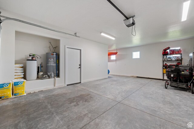 507 N 3650 W, Hurricane, UT 84737 - garage featuring strapped water heater and a garage door opener