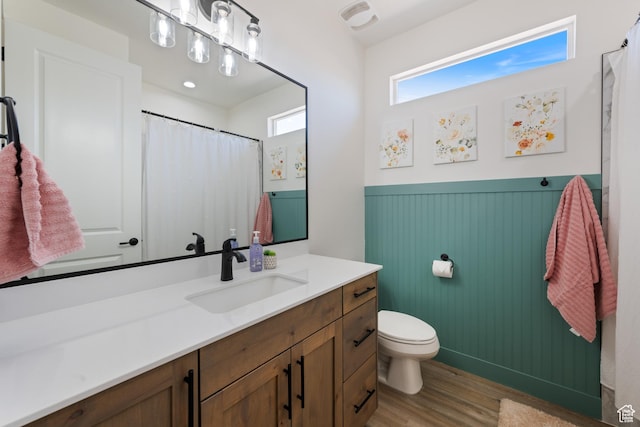 507 N 3650 W, Hurricane, UT 84737 - full bath featuring vanity, wood finished floors, a wainscoted wall, and a shower with shower curtain