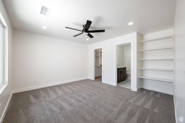 507 N 3650 W, Hurricane, UT 84737 - unfurnished bedroom featuring light carpet, a spacious closet, recessed lighting, ensuite bath, and ceiling fan