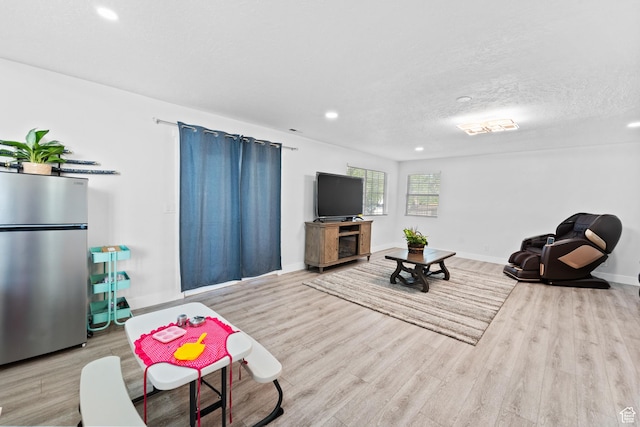 9375 S Laurel Ridge Cir, West Jordan, UT 84088 - living area featuring wood finished floors, recessed lighting, and a textured ceiling