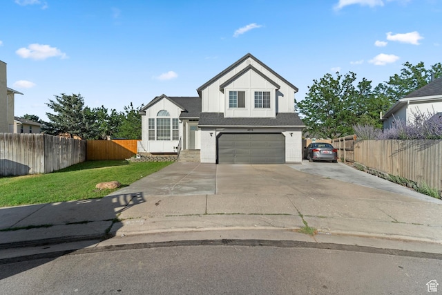 9375 S Laurel Ridge Cir, West Jordan, UT 84088 - view of front of property featuring driveway, a garage, board and batten siding, and a shingled roof