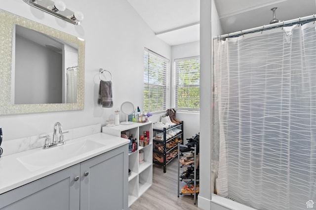 9375 S Laurel Ridge Cir, West Jordan, UT 84088 - full bath with vanity, wood finished floors, and a shower with curtain