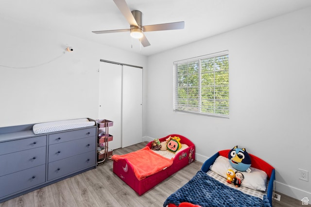 9375 S Laurel Ridge Cir, West Jordan, UT 84088 - bedroom featuring light wood-style floors, a closet, and a ceiling fan