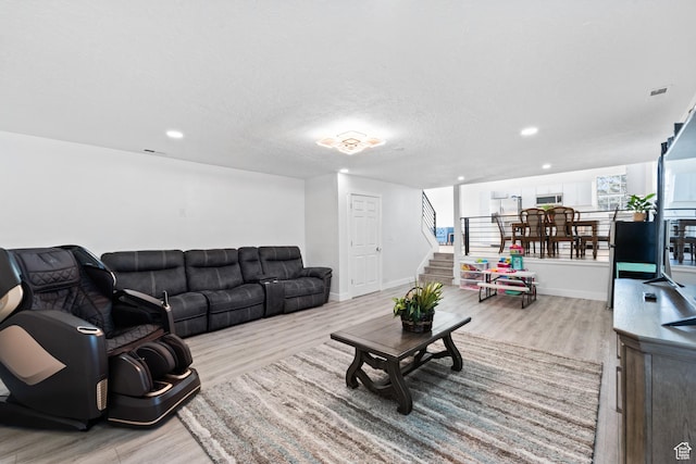 9375 S Laurel Ridge Cir, West Jordan, UT 84088 - living area with wood finished floors, stairs, plenty of natural light, and recessed lighting