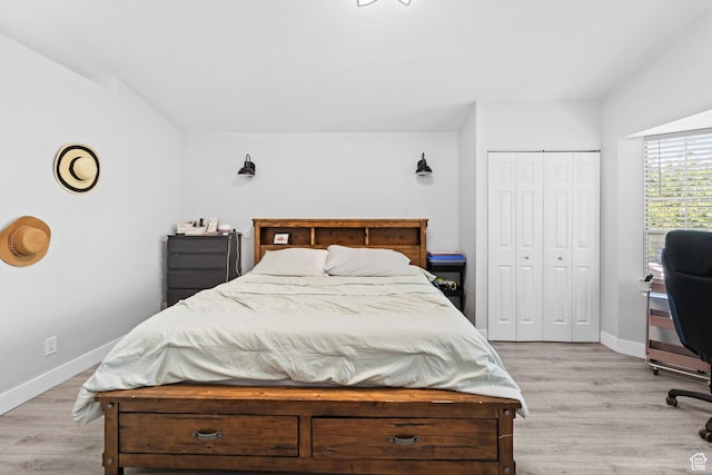 9375 S Laurel Ridge Cir, West Jordan, UT 84088 - bedroom with light wood-type flooring, a closet, and a desk