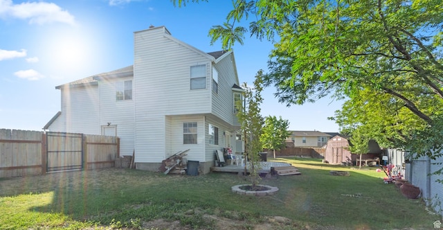 9375 S Laurel Ridge Cir, West Jordan, UT 84088 - back of property with a shed, a fenced backyard, and a deck
