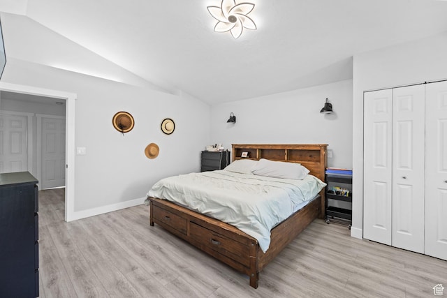 9375 S Laurel Ridge Cir, West Jordan, UT 84088 - bedroom featuring vaulted ceiling, light wood-style flooring, and a closet