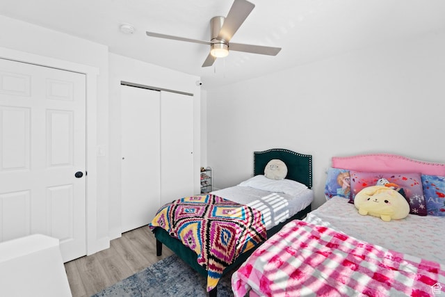 9375 S Laurel Ridge Cir, West Jordan, UT 84088 - bedroom featuring wood finished floors, a closet, and a ceiling fan