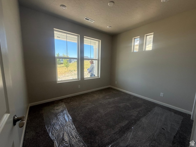 6184 W 11800 S Unit 508, Riverton, UT 84096 - spare room with dark colored carpet and a textured ceiling