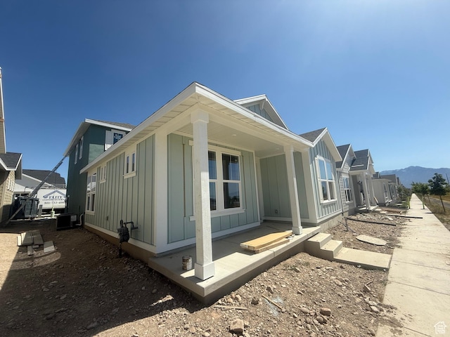 6184 W 11800 S Unit 508, Riverton, UT 84096 - view of side of property featuring board and batten siding and a mountain view
