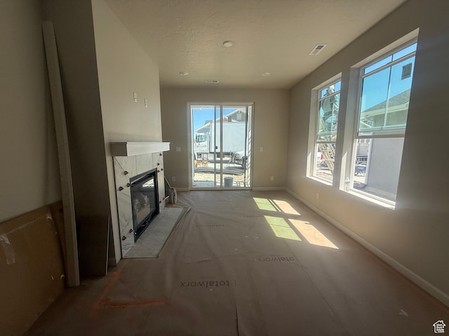 6184 W 11800 S Unit 508, Riverton, UT 84096 - unfurnished living room with a high end fireplace and baseboards