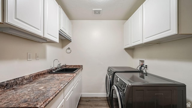 14267 S Palo Alto Dr, Herriman, UT 84096 - laundry area featuring dark wood-style flooring, cabinet space, and washing machine and dryer