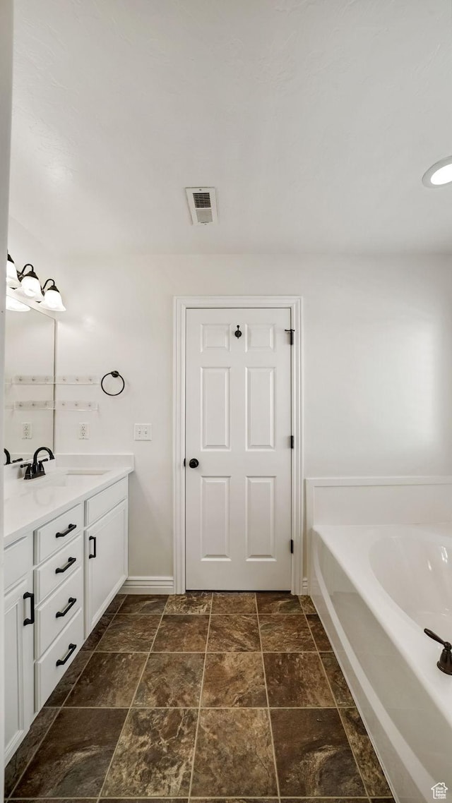 14267 S Palo Alto Dr, Herriman, UT 84096 - full bathroom with vanity, a bath, and stone finish flooring