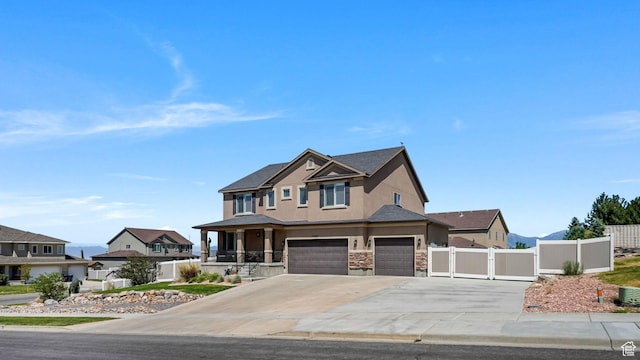 14267 S Palo Alto Dr, Herriman, UT 84096 - view of front of property featuring stucco siding, a garage, a gate, concrete driveway, and stone siding
