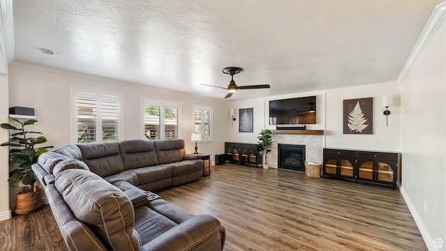 14267 S Palo Alto Dr, Herriman, UT 84096 - living area featuring a ceiling fan, wood finished floors, crown molding, a glass covered fireplace, and a textured ceiling