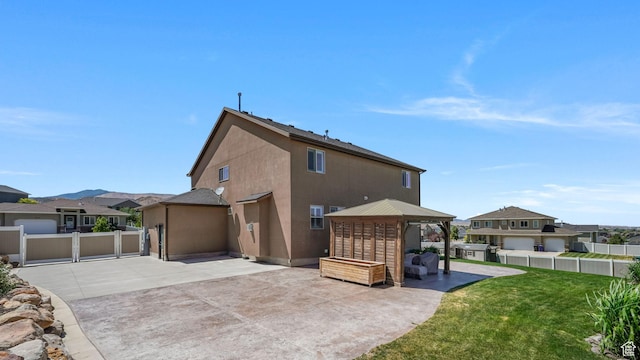 14267 S Palo Alto Dr, Herriman, UT 84096 - back of house with a patio area, a residential view, a gazebo, and stucco siding