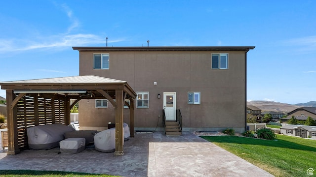 14267 S Palo Alto Dr, Herriman, UT 84096 - back of house featuring entry steps, a gazebo, a yard, a patio area, and a metal roof