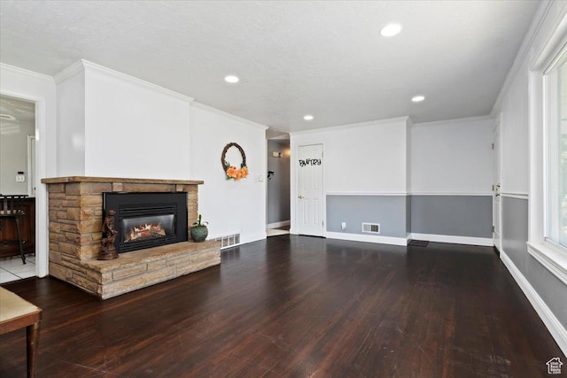 3524 W Meadowbrook Dr, West Valley City, UT 84119 - unfurnished living room with hardwood / wood-style flooring, a stone fireplace, crown molding, and recessed lighting