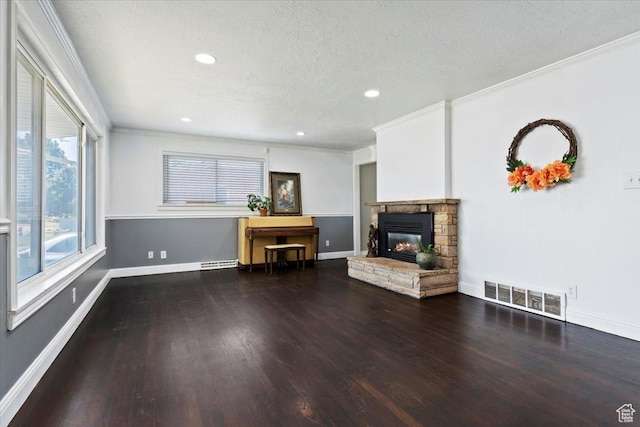3524 W Meadowbrook Dr, West Valley City, UT 84119 - living room with crown molding, a fireplace, wood finished floors, recessed lighting, and a textured ceiling
