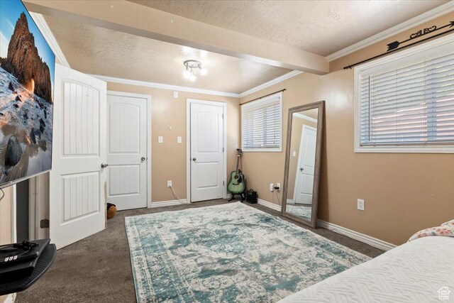 3524 W Meadowbrook Dr, West Valley City, UT 84119 - bedroom featuring dark carpet, a textured ceiling, crown molding, and beam ceiling