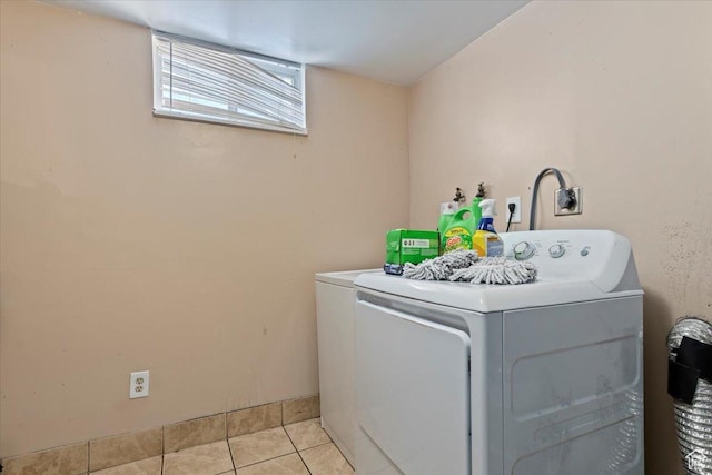 3524 W Meadowbrook Dr, West Valley City, UT 84119 - washroom with light tile patterned flooring and washing machine and dryer