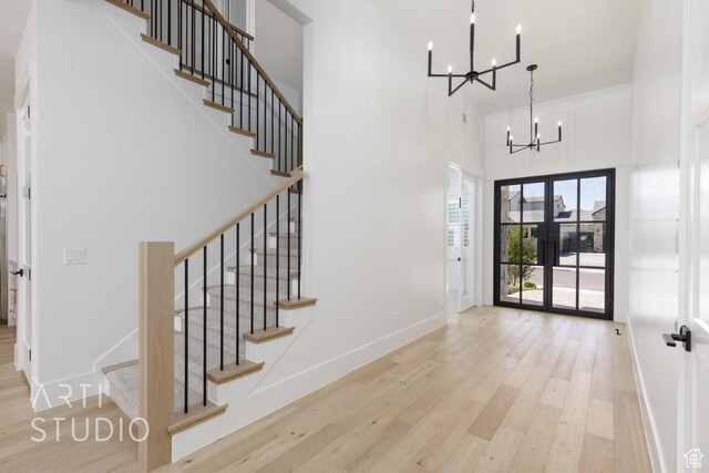 671 E Arina Way, Washington, UT 84780 - entryway with a chandelier, a high ceiling, wood finished floors, and stairway