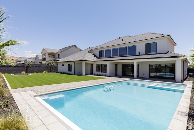 671 E Arina Way, Washington, UT 84780 - rear view of house with stucco siding, a pool with connected hot tub, a patio, and a tile roof