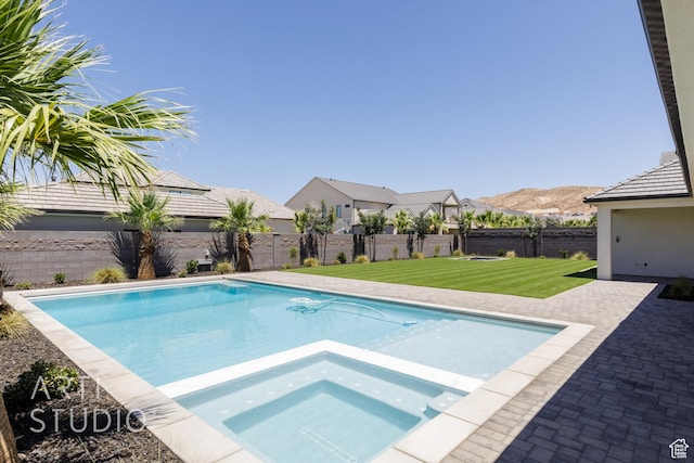 671 E Arina Way, Washington, UT 84780 - view of swimming pool with a fenced backyard, a pool with connected hot tub, and a patio area