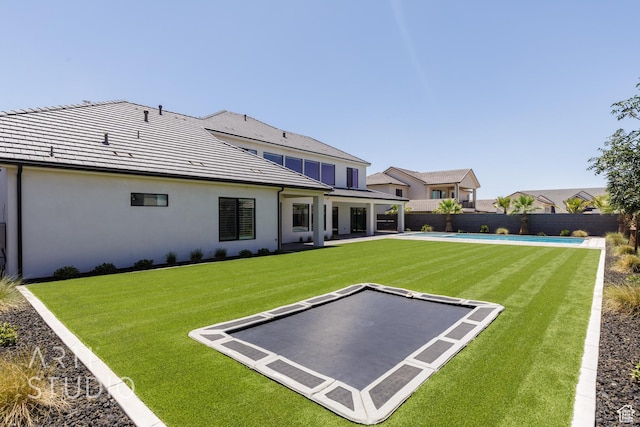 671 E Arina Way, Washington, UT 84780 - rear view of property featuring a fenced backyard, stucco siding, and a patio area