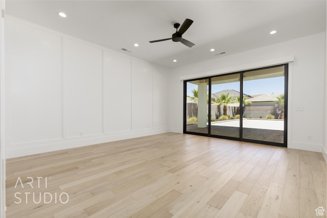 671 E Arina Way, Washington, UT 84780 - empty room with light wood-style floors, a decorative wall, a ceiling fan, and recessed lighting